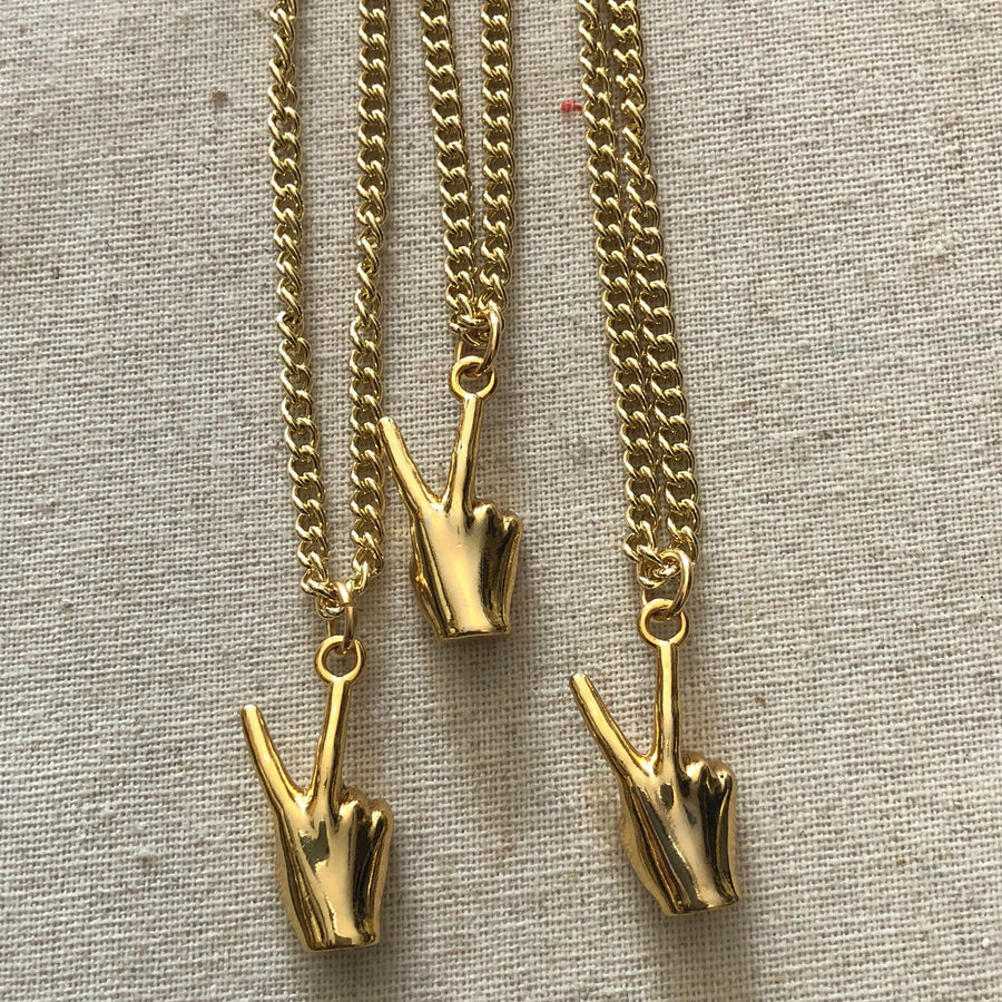 GOLD PEACE HAND NECKLACE